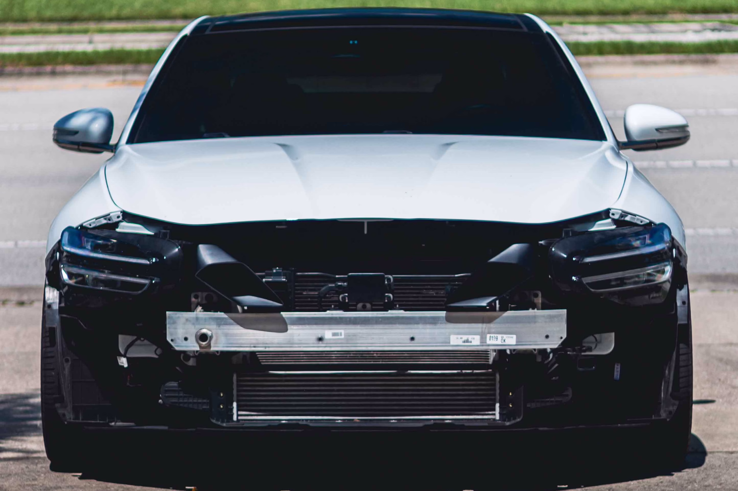 Genesis G70 engine bay with intake shroud installed