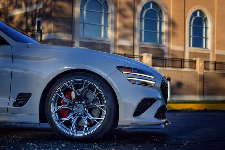 Genesis G70 running PLUGNPLAYCUSTOMS amber DRLs and stainless steel quad tips